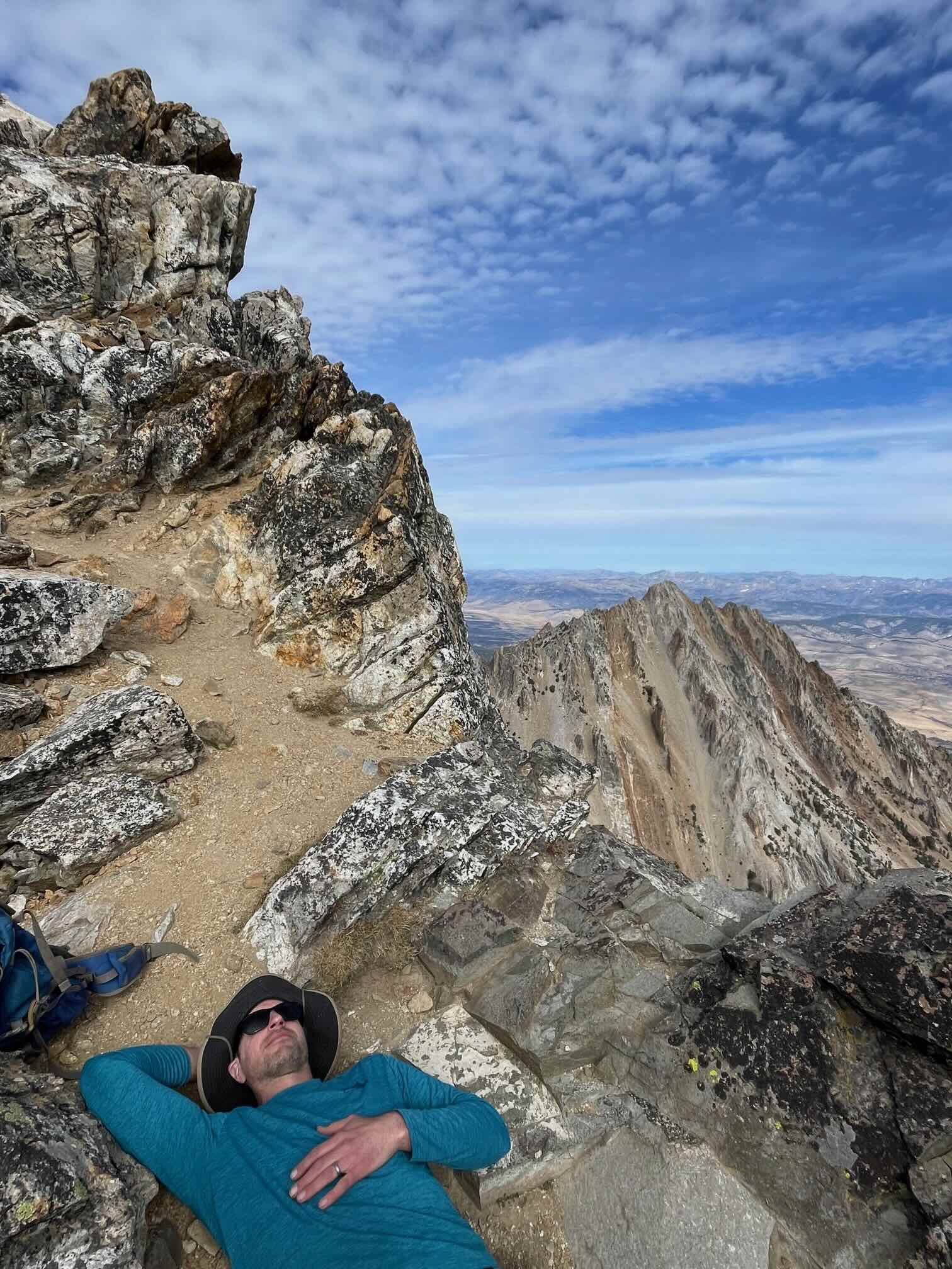 Jeff relaxing on a mountain summit
